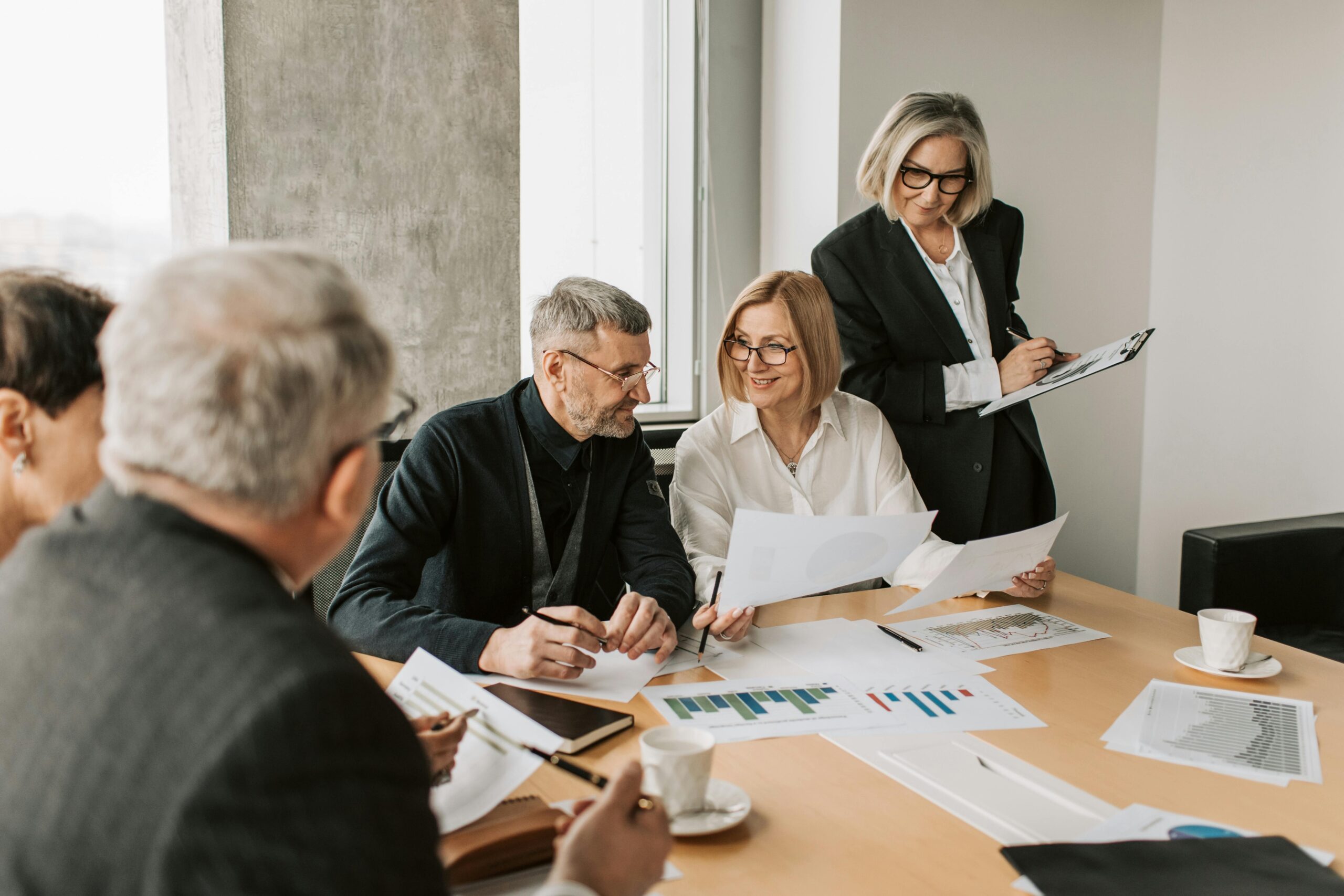 Group of diverse gamers discussing poll outcomes at a virtual table
